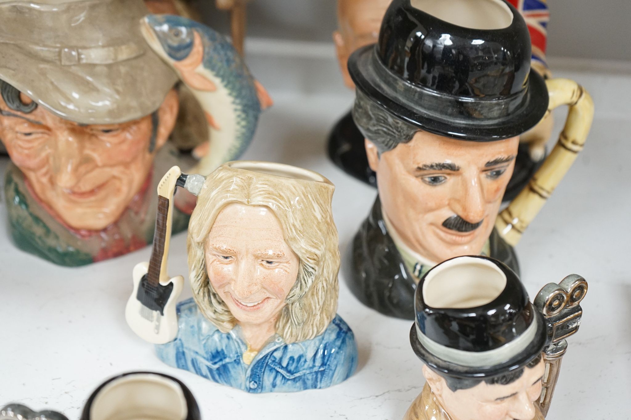 A collection of Royal Doulton character jugs, most boxed